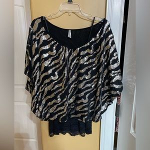 Size medium(fits more like large), black and silver sparkly top